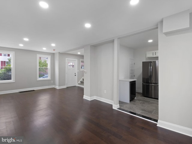 2603 N Tatnall St, Wilmington, DE 19802 - unfurnished living room featuring dark wood-style flooring, recessed lighting, and stairs