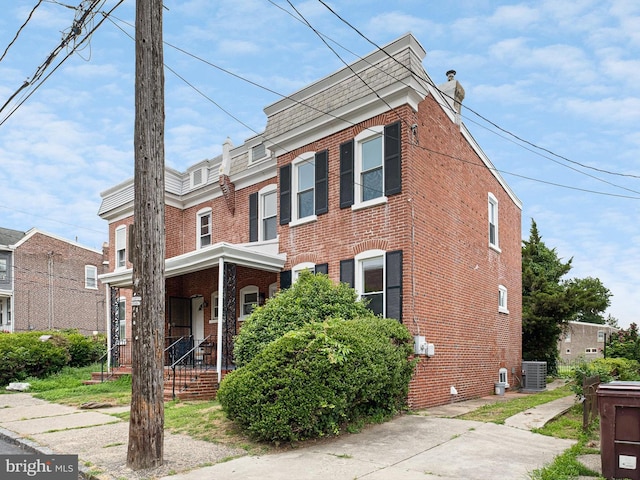 2603 N Tatnall St, Wilmington, DE 19802 - view of front facade featuring brick siding and a chimney