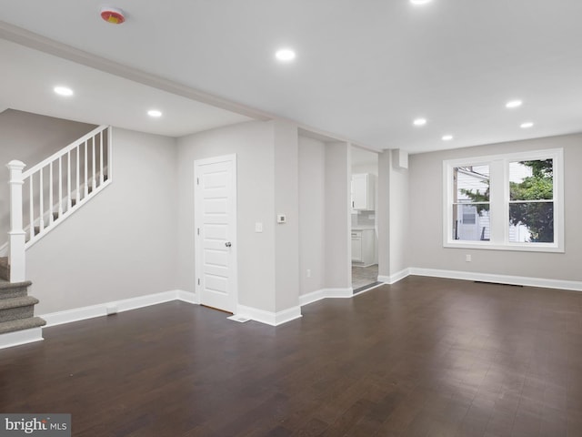 2603 N Tatnall St, Wilmington, DE 19802 - unfurnished living room with stairway, dark wood finished floors, and recessed lighting