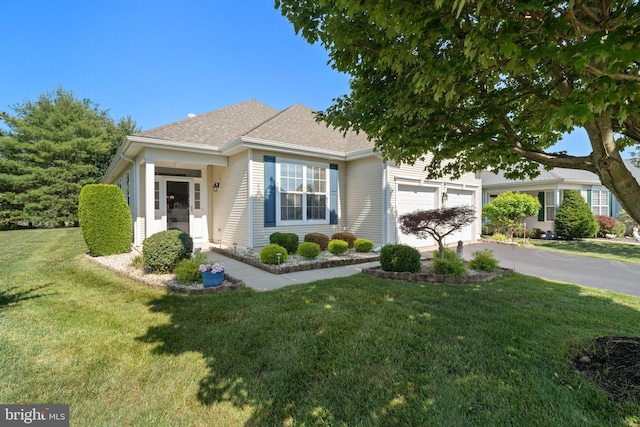 8 Spout Ter, Barnegat, NJ 08005 - view of property hidden behind natural elements featuring concrete driveway, a garage, a front yard, and roof with shingles