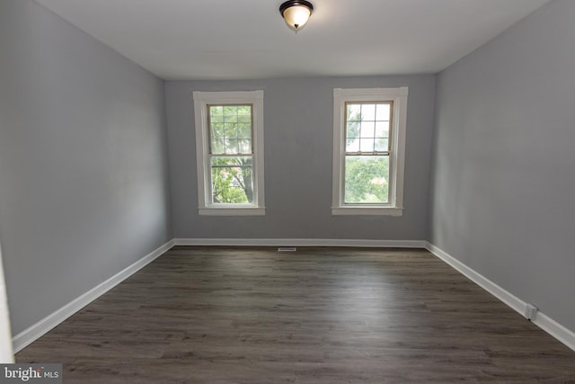 2149 Harford Rd, Baltimore, MD 21218 - empty room featuring healthy amount of natural light and dark wood-style floors