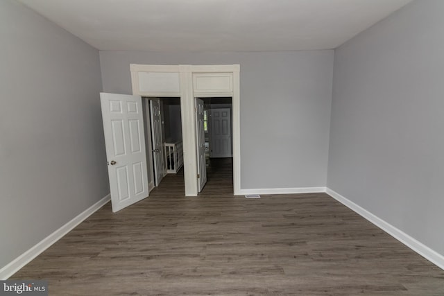 2149 Harford Rd, Baltimore, MD 21218 - unfurnished bedroom featuring baseboards and wood finished floors