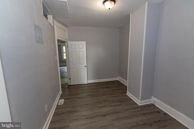 2149 Harford Rd, Baltimore, MD 21218 - spare room featuring baseboards and dark wood-type flooring