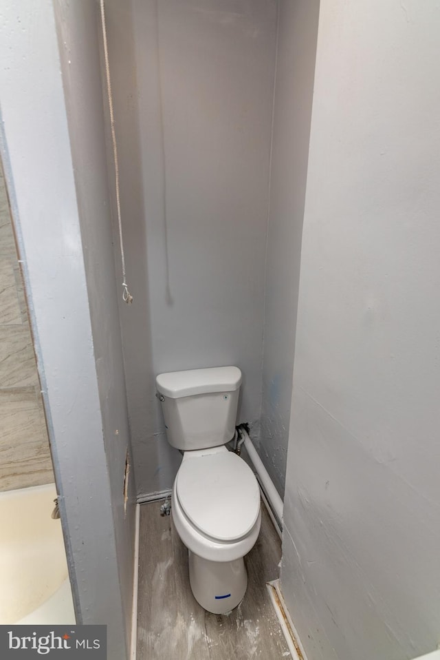 2149 Harford Rd, Baltimore, MD 21218 - bathroom featuring toilet and wood finished floors