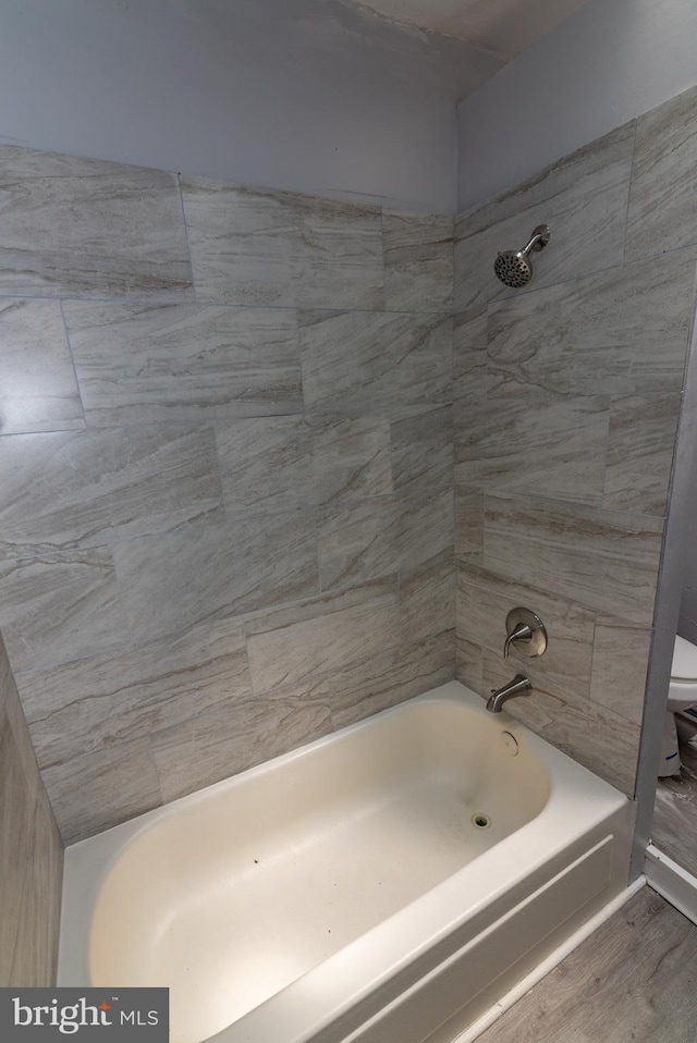 2149 Harford Rd, Baltimore, MD 21218 - bathroom featuring shower / washtub combination and wood finished floors