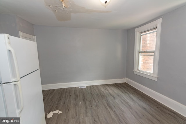 2149 Harford Rd, Baltimore, MD 21218 - spare room featuring wood finished floors and baseboards