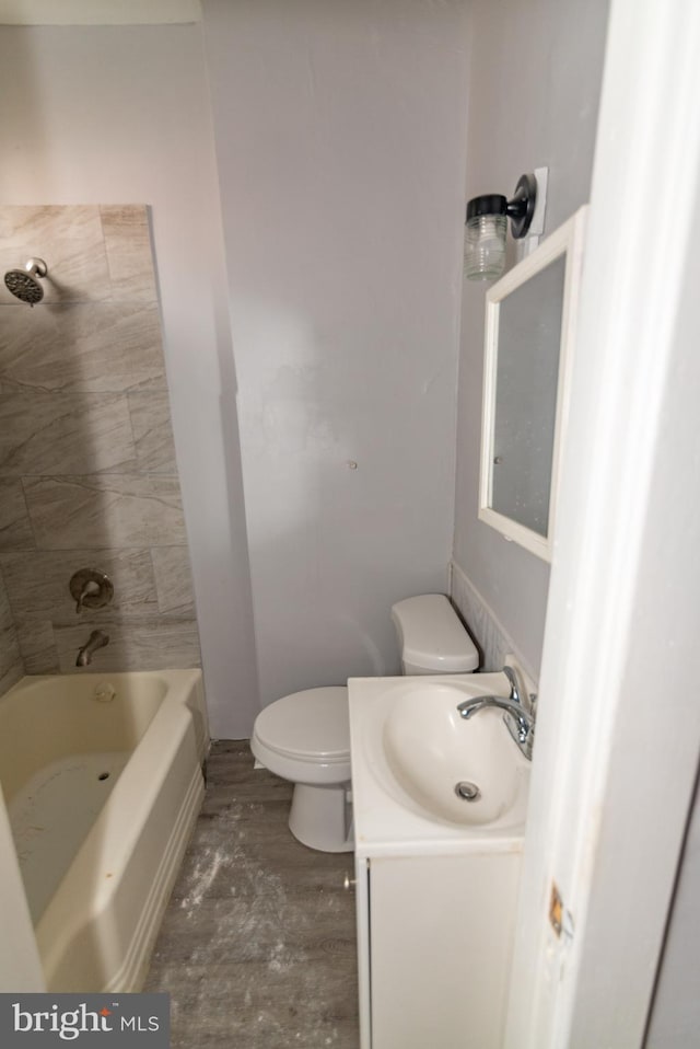 2149 Harford Rd, Baltimore, MD 21218 - bathroom featuring vanity, washtub / shower combination, and wood finished floors