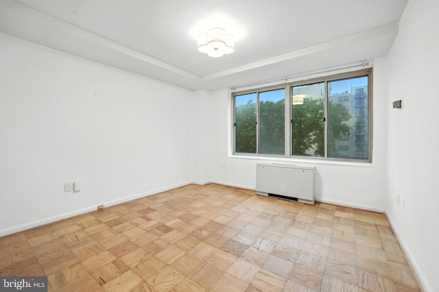 922 24th St NW Unit 504, Washington, DC 20037 - empty room featuring radiator heating unit and baseboards