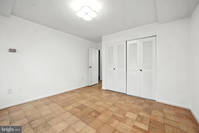 922 24th St NW Unit 504, Washington, DC 20037 - unfurnished bedroom featuring baseboards and a closet
