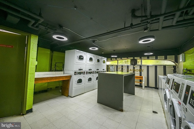 922 24th St NW Unit 504, Washington, DC 20037 - communal laundry room featuring stacked washing machine and dryer and washer and clothes dryer