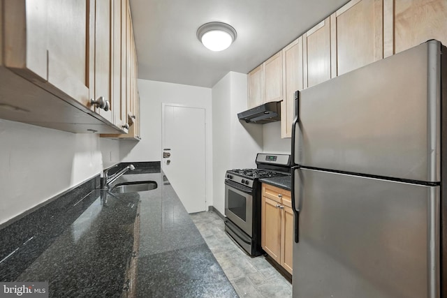 922 24th St NW Unit 504, Washington, DC 20037 - kitchen featuring stainless steel appliances, under cabinet range hood, light brown cabinets, and dark stone counters