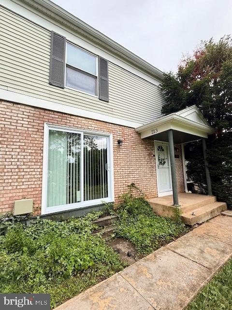 213 Hammershire Rd Unit D, Reisterstown, MD 21136 - doorway to property featuring brick siding