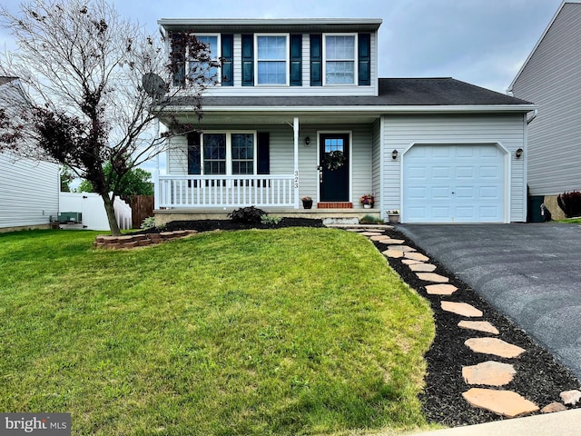 323 Swatara Creek Dr, Jonestown, PA 17038 - traditional-style home featuring covered porch, an attached garage, and asphalt driveway