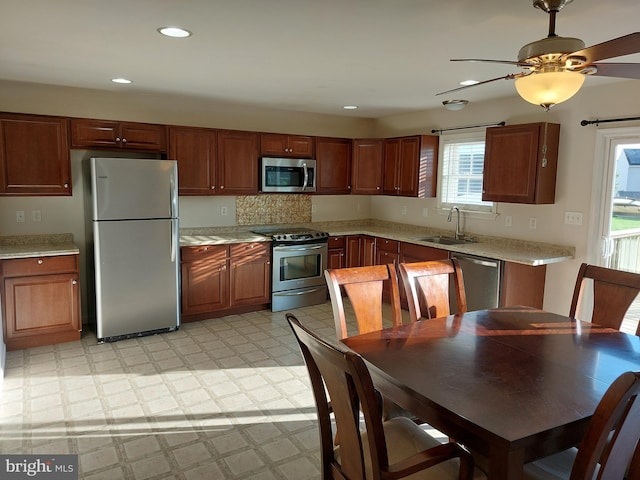 323 Swatara Creek Dr, Jonestown, PA 17038 - kitchen featuring appliances with stainless steel finishes, light flooring, a ceiling fan, recessed lighting, and decorative backsplash