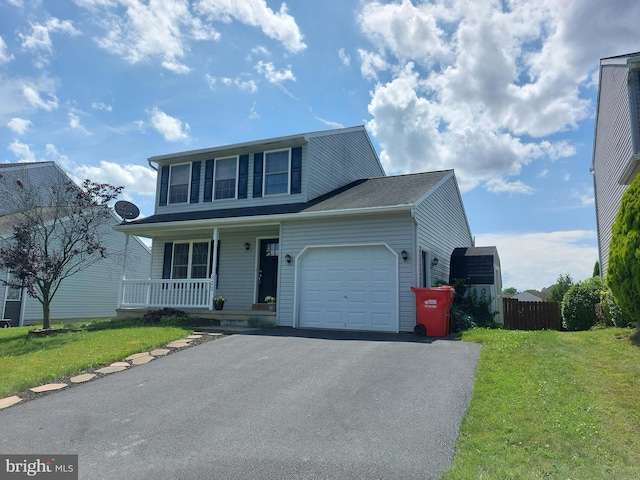 323 Swatara Creek Dr, Jonestown, PA 17038 - traditional-style house featuring a porch, an attached garage, and asphalt driveway