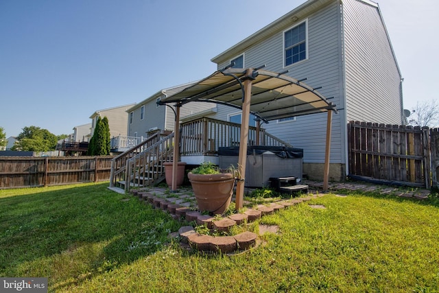 323 Swatara Creek Dr, Jonestown, PA 17038 - rear view of house featuring a hot tub, a fenced backyard, a deck, and stairway