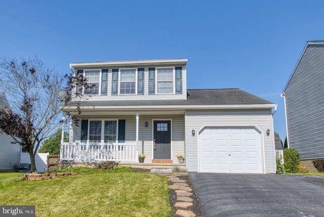 323 Swatara Creek Dr, Jonestown, PA 17038 - traditional home featuring covered porch, an attached garage, asphalt driveway, and a front lawn