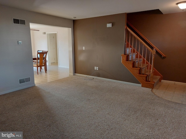 323 Swatara Creek Dr, Jonestown, PA 17038 - unfurnished living room featuring carpet flooring and stairway
