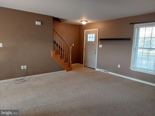 323 Swatara Creek Dr, Jonestown, PA 17038 - carpeted foyer entrance featuring stairs and baseboards