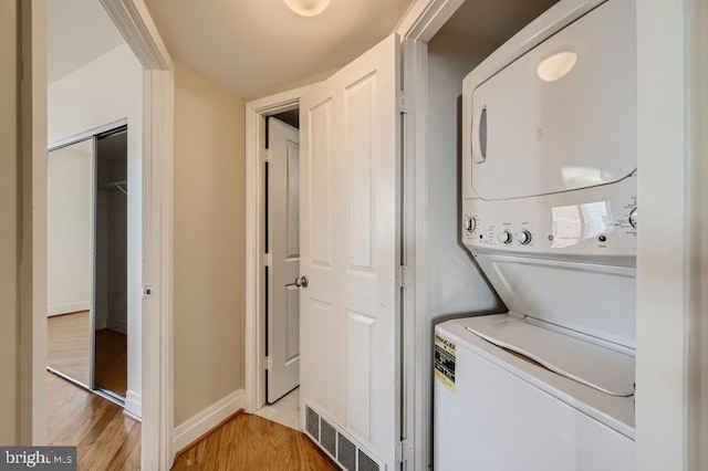 414 Water St Unit 2814, Baltimore, MD 21202 - washroom with stacked washer / dryer and light wood-type flooring