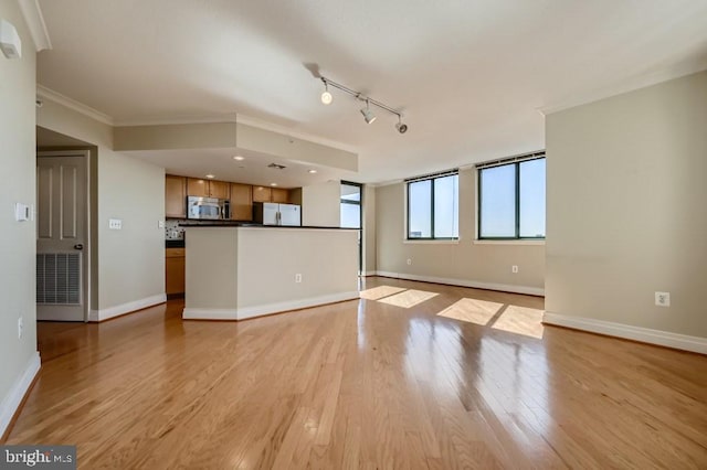 414 Water St Unit 2814, Baltimore, MD 21202 - unfurnished living room featuring light wood-type flooring, ornamental molding, and track lighting