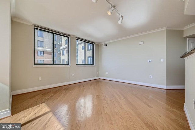 414 Water St Unit 2814, Baltimore, MD 21202 - empty room with wood finished floors, crown molding, and track lighting