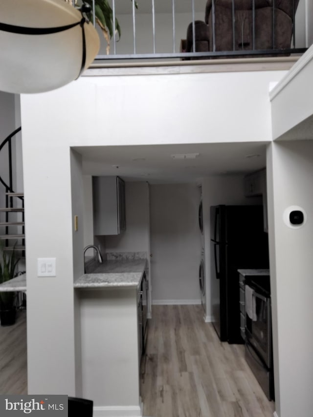 14007 Vista Dr Unit 30, Laurel, MD 20707 - kitchen with range, light wood finished floors, and light countertops