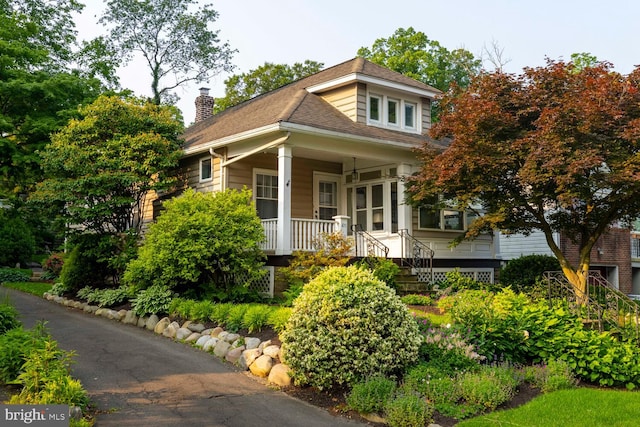 671 Edge Hill Rd, Glenside, PA 19038 - view of front of property with a porch, a chimney, and a shingled roof