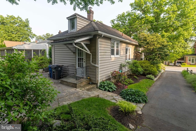 671 Edge Hill Rd, Glenside, PA 19038 - view of side of property with a chimney and roof with shingles