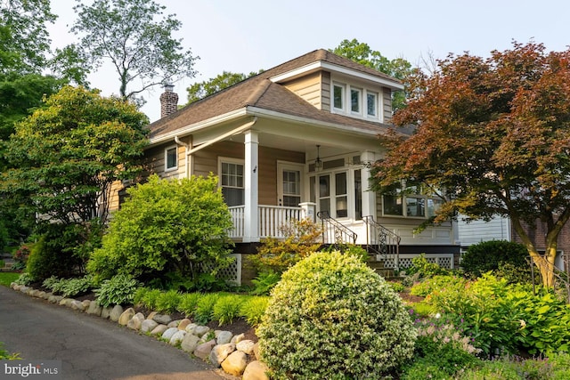 671 Edge Hill Rd, Glenside, PA 19038 - view of front of house featuring covered porch, a chimney, and roof with shingles