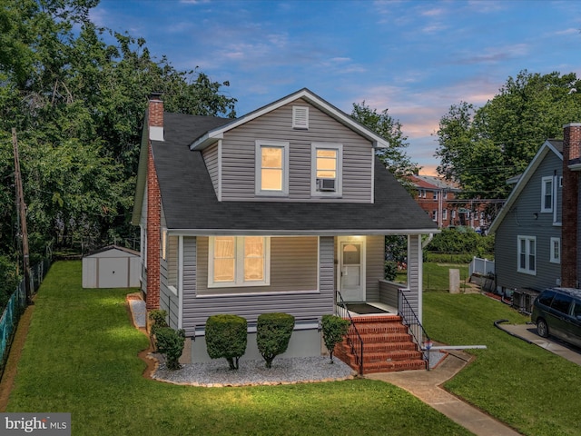 5000 Levindale Rd, Baltimore, MD 21215 - view of front of home featuring a porch, a storage unit, a front lawn, and a chimney