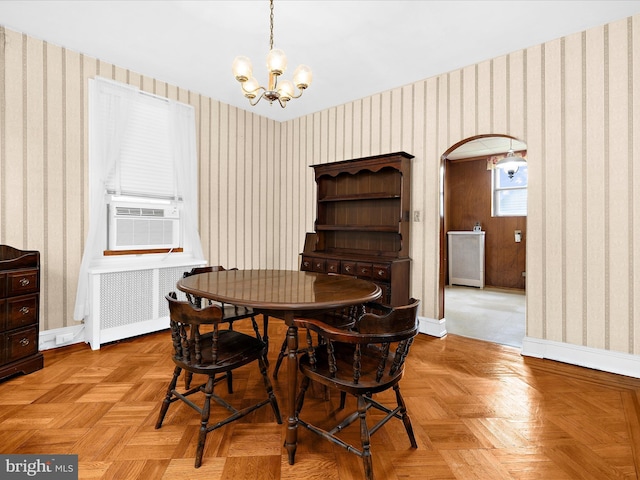 5000 Levindale Rd, Baltimore, MD 21215 - dining area with wallpapered walls, radiator heating unit, a chandelier, and cooling unit