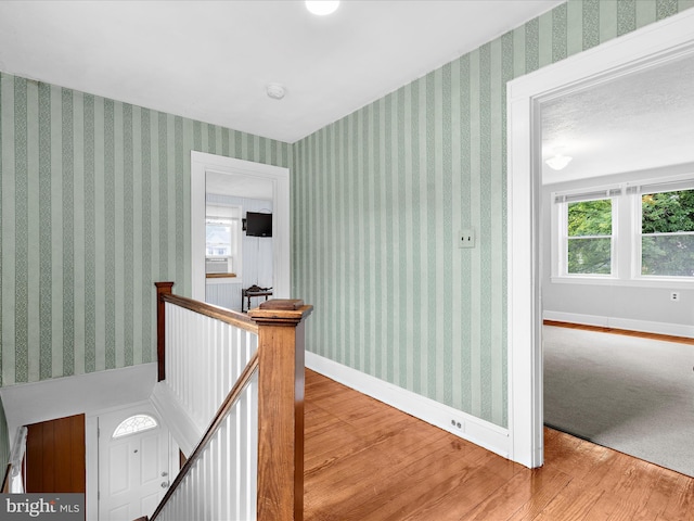 5000 Levindale Rd, Baltimore, MD 21215 - hallway featuring an upstairs landing, wood finished floors, and plenty of natural light
