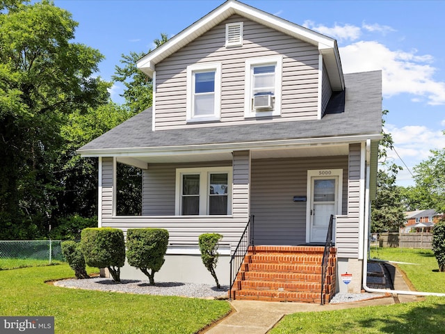 5000 Levindale Rd, Baltimore, MD 21215 - view of front of home with covered porch, cooling unit, and roof with shingles