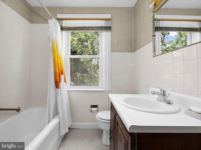 5000 Levindale Rd, Baltimore, MD 21215 - full bathroom featuring tile walls, vanity, shower / bath combo, and tile patterned flooring
