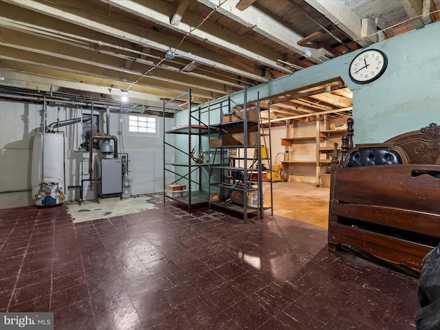 5000 Levindale Rd, Baltimore, MD 21215 - below grade area with water heater, tile patterned floors, and a heating unit