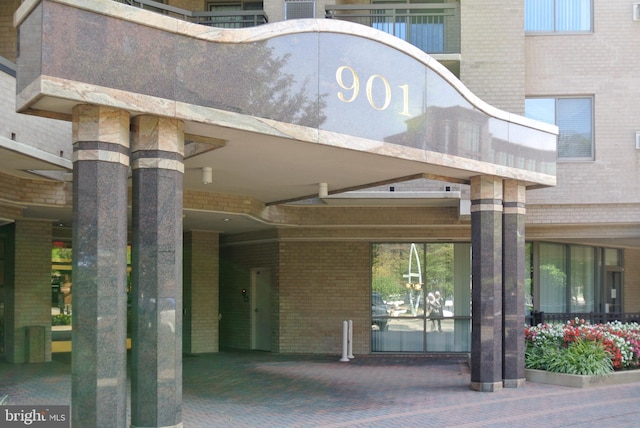 901 N Monroe St Unit 308, Arlington, VA 22201 - view of exterior entry featuring brick siding