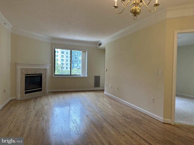 901 N Monroe St Unit 308, Arlington, VA 22201 - unfurnished living room with a chandelier, wood finished floors, ornamental molding, and a high end fireplace