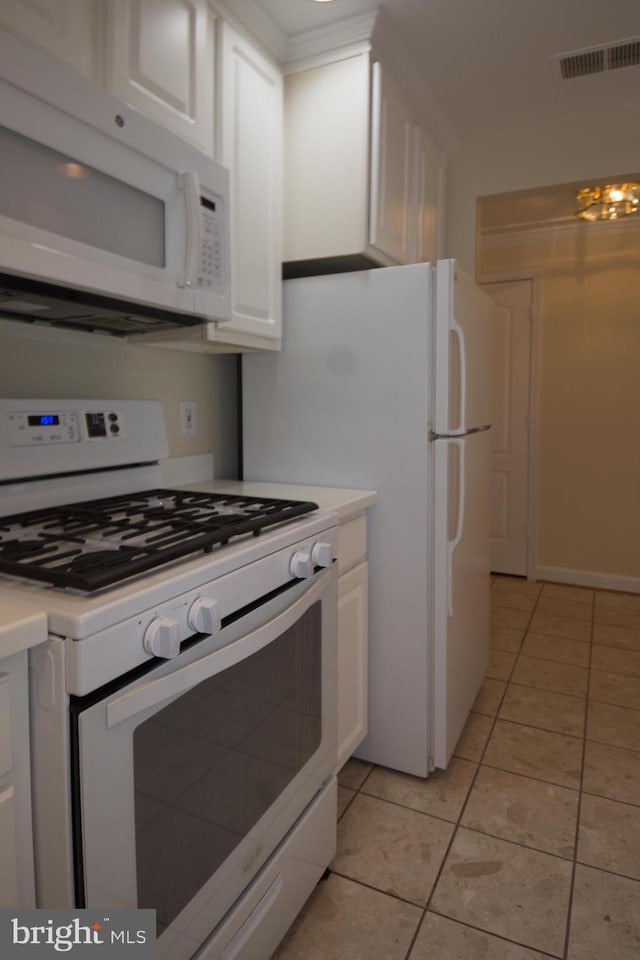 901 N Monroe St Unit 308, Arlington, VA 22201 - kitchen featuring white appliances, light tile patterned floors, white cabinetry, and light countertops