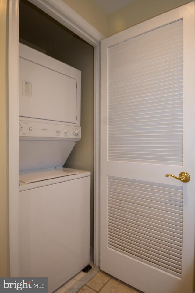 901 N Monroe St Unit 308, Arlington, VA 22201 - washroom featuring stacked washer and clothes dryer and light tile patterned floors
