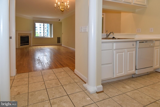 901 N Monroe St Unit 308, Arlington, VA 22201 - kitchen featuring dishwasher, ornamental molding, white cabinetry, a chandelier, and light tile patterned floors