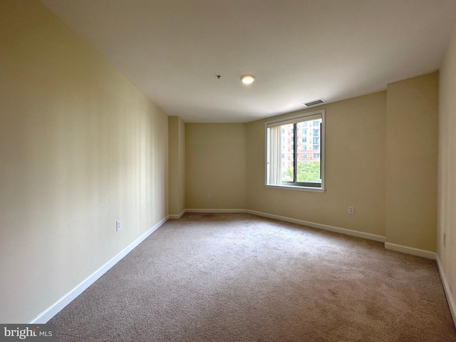 901 N Monroe St Unit 308, Arlington, VA 22201 - carpeted spare room with baseboards