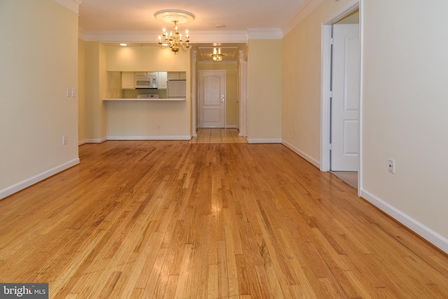 901 N Monroe St Unit 308, Arlington, VA 22201 - unfurnished living room featuring a chandelier, light wood-type flooring, and crown molding