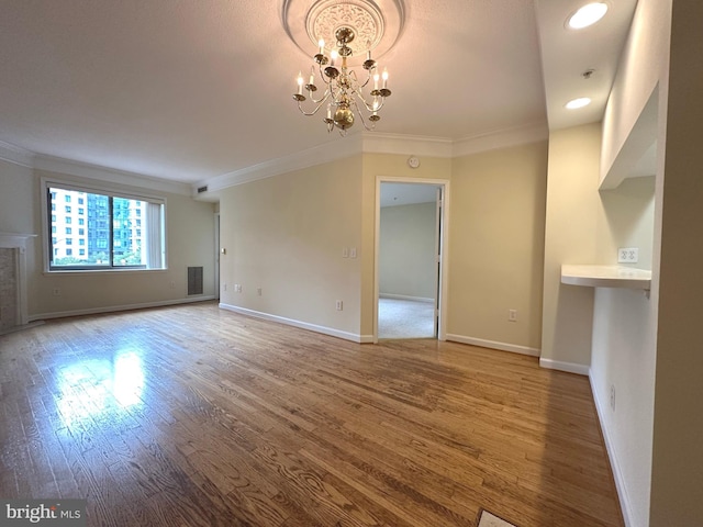 901 N Monroe St Unit 308, Arlington, VA 22201 - unfurnished living room featuring ornamental molding, wood finished floors, a chandelier, and recessed lighting
