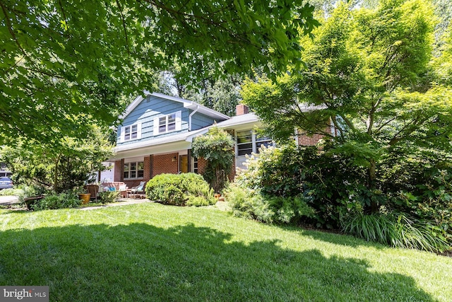 1490 Grandview Ct, Arnold, MD 21012 - view of front of property featuring brick siding, a front yard, and a chimney