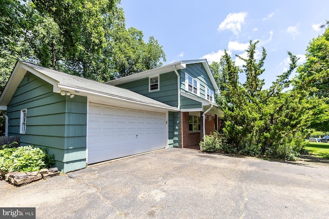 1490 Grandview Ct, Arnold, MD 21012 - view of front of house with brick siding, asphalt driveway, and an attached garage