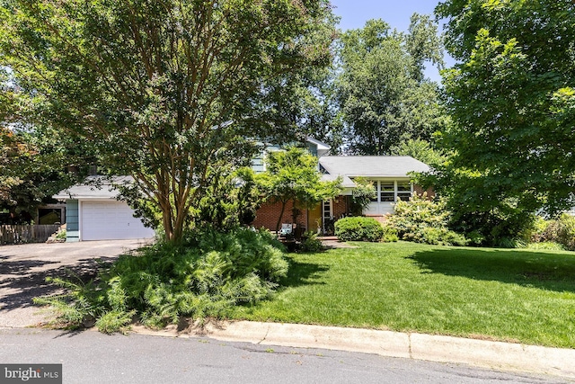 1490 Grandview Ct, Arnold, MD 21012 - obstructed view of property with asphalt driveway, a front yard, an attached garage, and brick siding