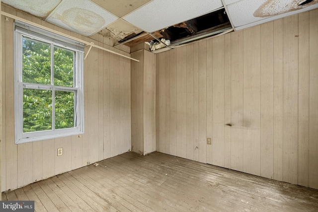 527 Berwyn Baptist Rd, Berwyn, PA 19312 - spare room featuring wood-type flooring, healthy amount of natural light, and wooden walls