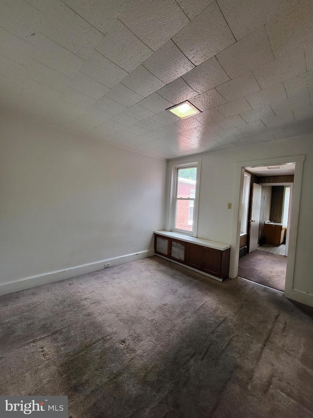 329 N 13th St, Reading, PA 19604 - carpeted empty room featuring baseboards