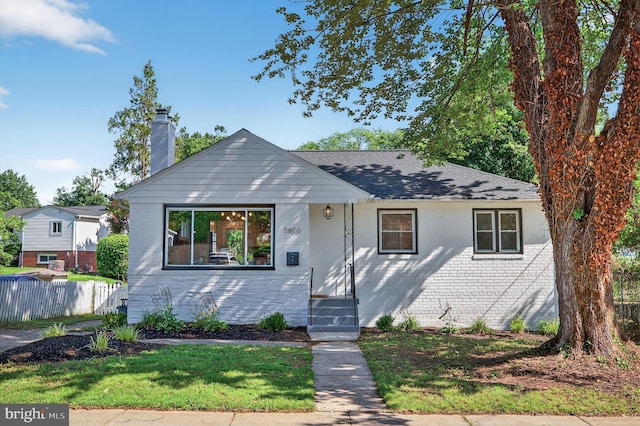 3803 Kayson St, Silver Spring, MD 20906 - bungalow-style home with a chimney, roof with shingles, and brick siding